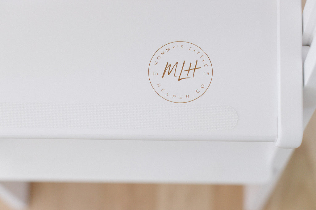 A close up of our anti slip strips on the white learning tower platform. 