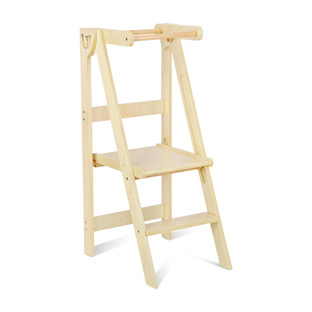 A wooden folding learning tower set up