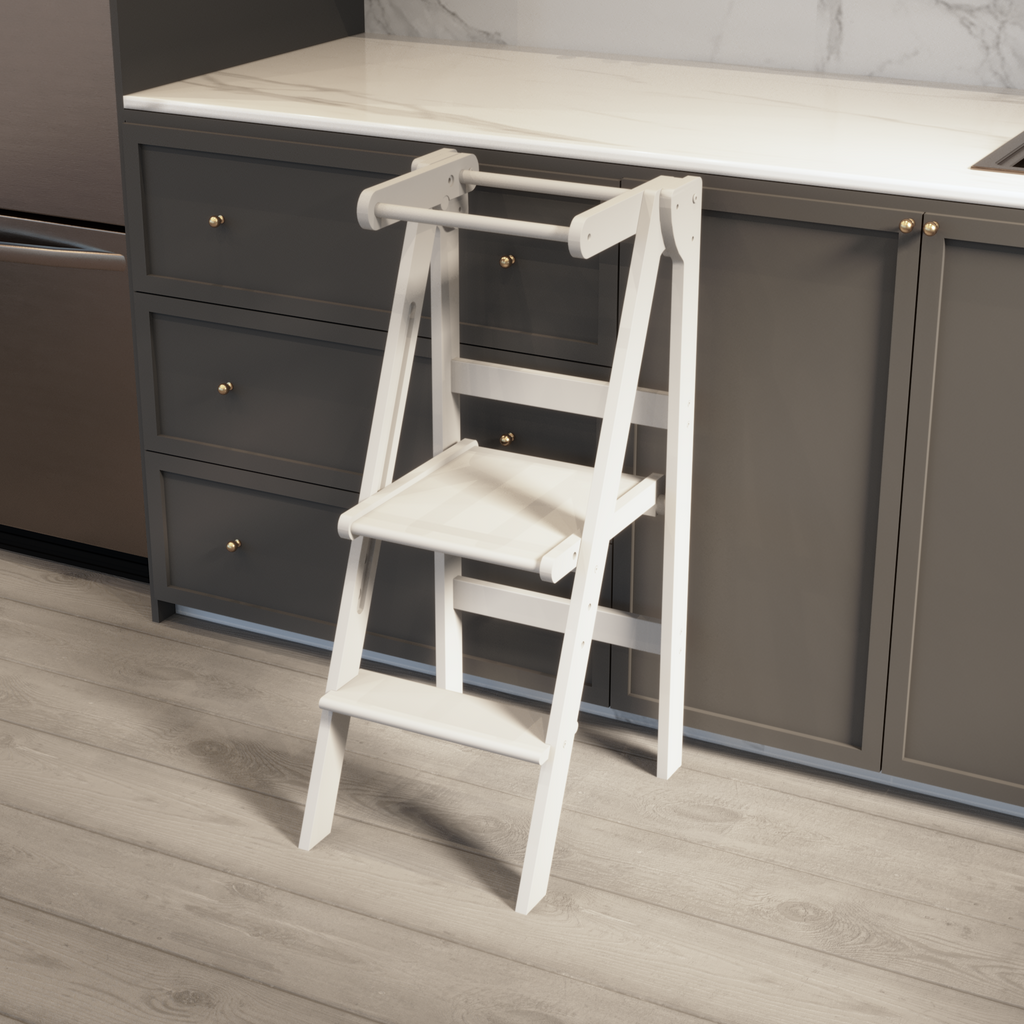 Our white learning tower with new height adjustable platforms that folds to store. 