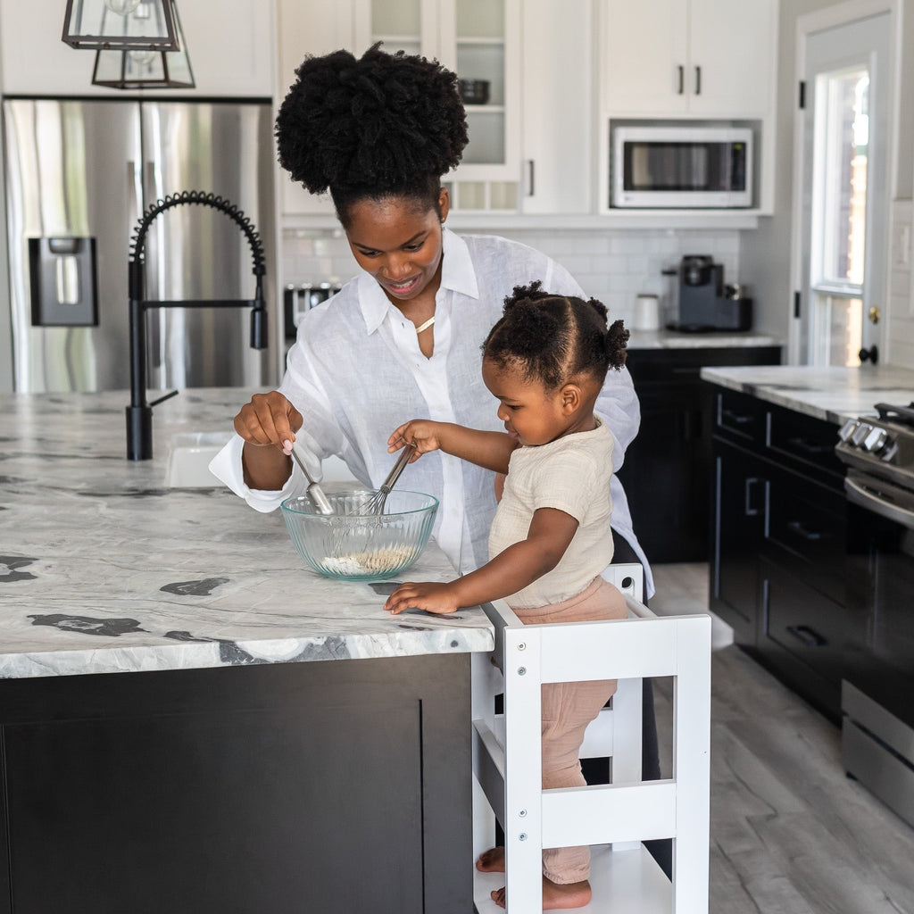 Mother and Child mixing ingredients at counter using Montessori Toddler Learning Tower - Kitchen Helper