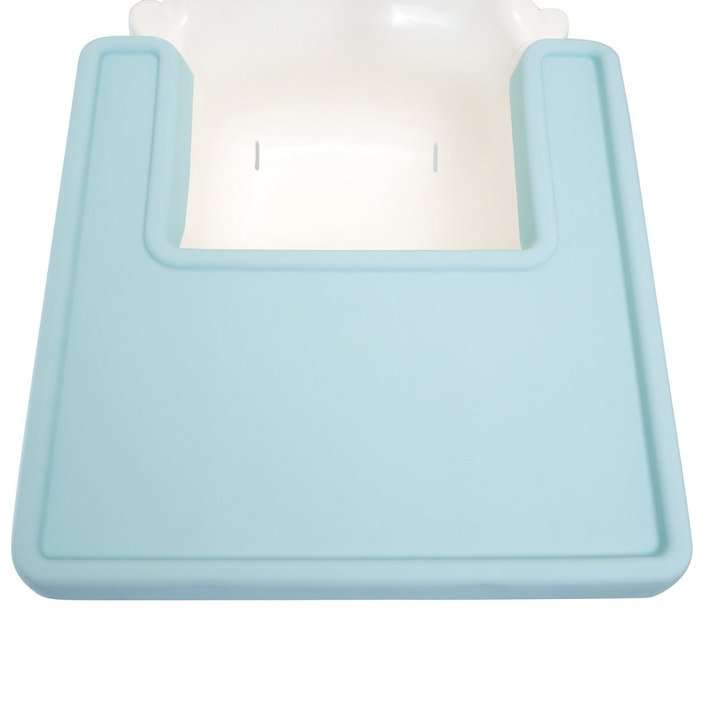 a blue silicone highchair placemat with the while ikea highchair in the background